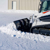 Hitch Doc Skid Steer Snow Plow action shot of clearing snow 