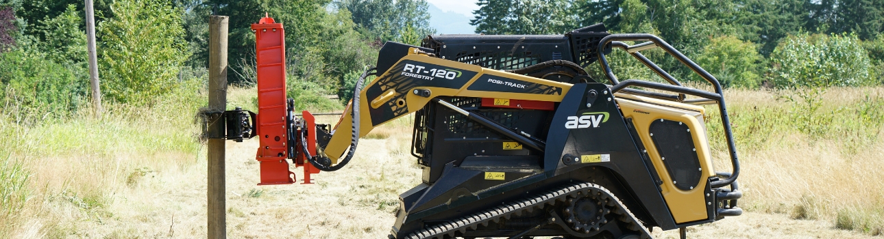 Skid Steer Post Driver Attachment right side view of a skid steer parked in a field with an Eterra PDX-1000 Post Driver attachment on the front grappling a post