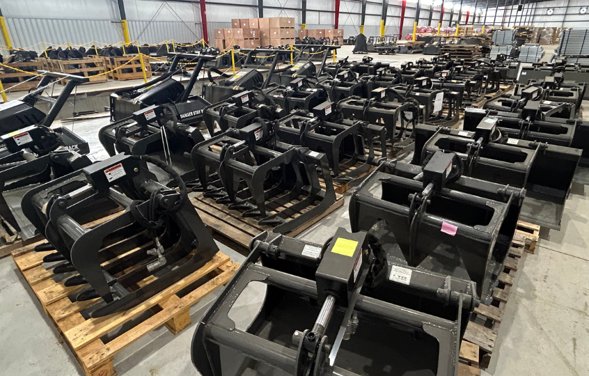 above angle view of in-stock attachments in skid steer solutions' warehouse