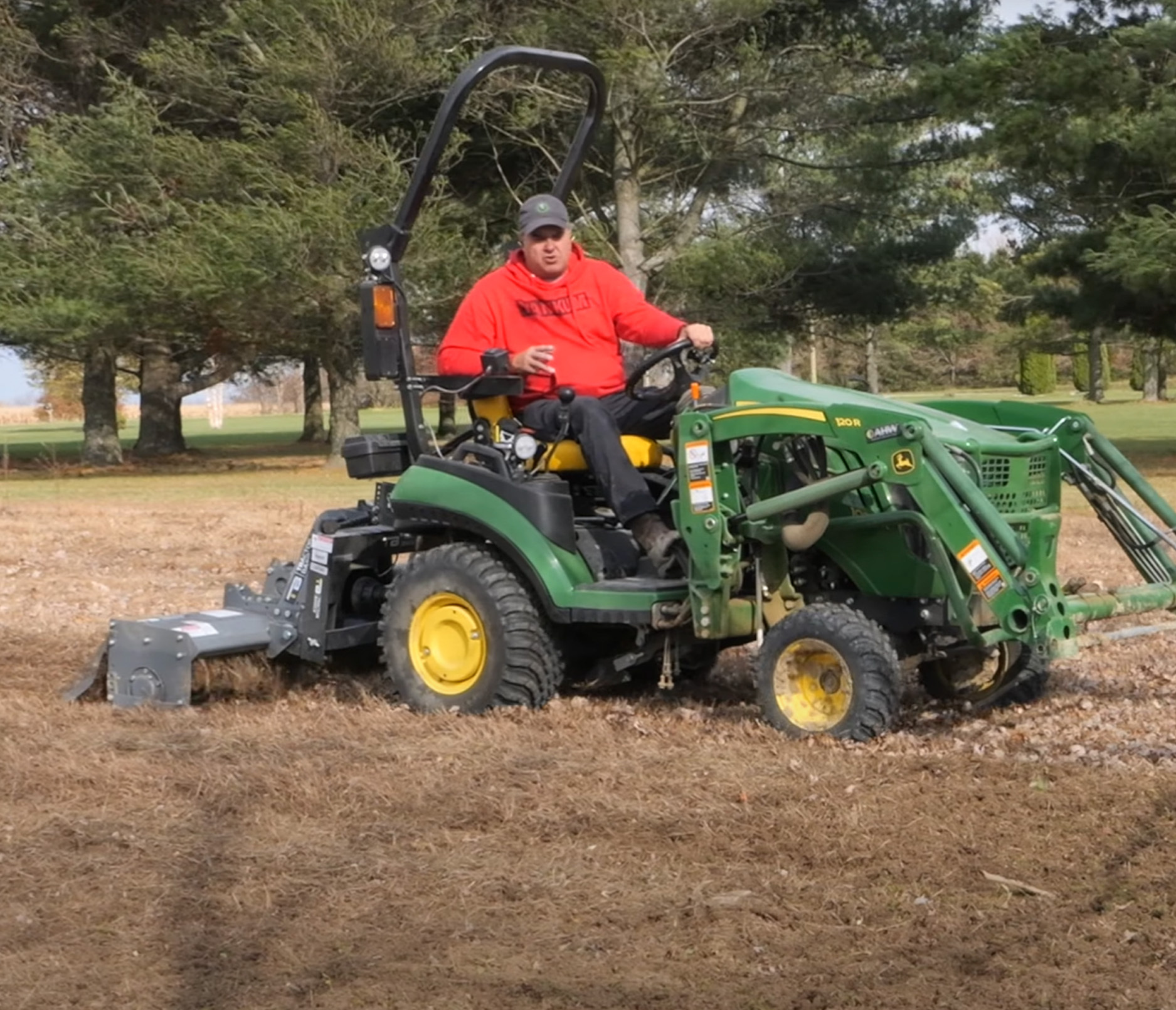 tractor Tim operating his john deere compact tractor with the tractor basics UL Series Light Duty Gear Drive Tiller Attachment hitched on the back