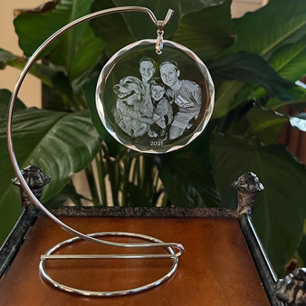 Ornament Stand, decorative stand displaying a personalized engraved glass ornament with a photo of children and a dog, dated 2021.