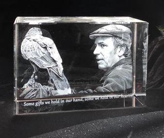 3D Photo Crystal Block, engraved with a detailed image of a man and a bird, featuring the quote 'Some gifts we hold in our hand, some we hold in our heart.' engraved at the bottom.  K9 crystal