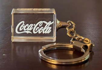 Corporate Promotional Rectangular Crystal Keychain, transparent rectangular crystal keyring with Coca-Cola logo engraved.