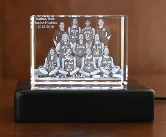 Crystal Print Corporate Recognition Award Crystal Block, engraved with a team photo and text, on a black base.