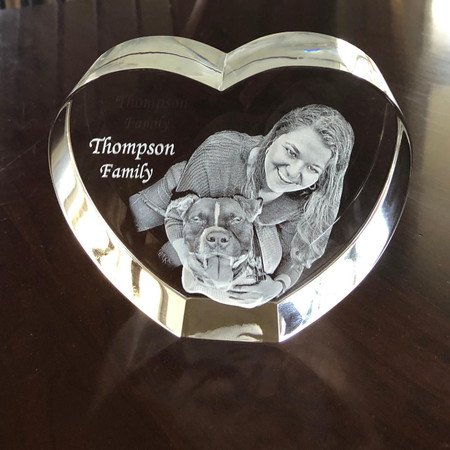 Crystal Print 3D Photo Crystal Heart, engraved with a woman smiling and a dog, personalized with the text 'Thompson Family'.