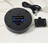 Crystal Print Rotating Black Light Base, black round rotating base with battery compartment, power cord, and remote control on white marble surface.