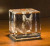 Crystal Print 3D Crystal Pet Cube, transparent 3D-printed crystal cube with an engraved image of a dog inside.