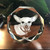 Crystal Prints Pet Memorial Jeweled Puck, engraved with a portrait of a dog and the name 'Luisa' at the bottom.