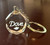 Corporate Promotional Round Crystal Keychain, gold-tone keychain with a round crystal face featuring the Dove logo.