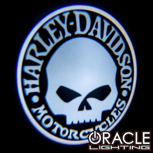 Sample logo projection of Oracle Lighting Harley Davidson Skull LED Door Projector Light, Side view of Oracle Lighting Harley Davidson Skull LED Door Projector Light, Front view of Oracle Lighting Harley Davidson Skull LED Door Projector Light, Back view of Oracle Lighting Harley Davidson Skull LED Door Projector Light, Box of Oracle Lighting Harley Davidson Skull LED Door Projector Light