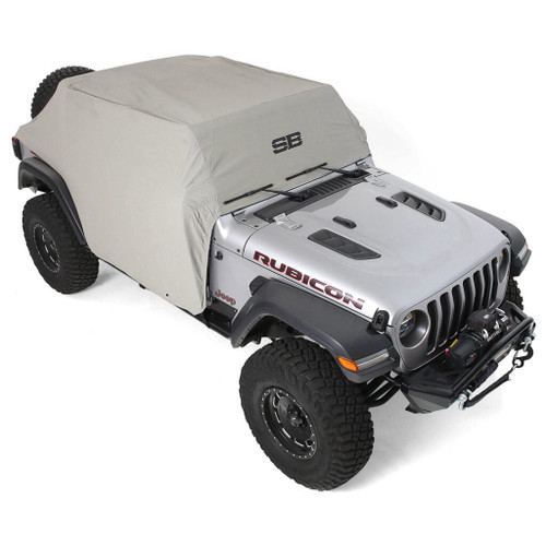 Jeep is covered by a Smittybilt water-resistant cab cover featuring door flaps for extra durability against the elements.