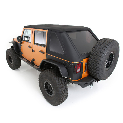A jeep showcasing an orange top and black tires, equipped with a Smittybilt Bowless Combo Top and tinted windows.