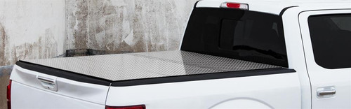 The Access B0070019 LOMAX Professional Series Hard Folding Tonneau Cover provides robust protection for your truck with a durable diamond-plate aluminum top and extruded aluminum frame. This ultra-low-profile cover offers easy installation with no drilling required and a 500-lb load capacity. It features a weather-tight seal to keep cargo dry and clean, and its folding design ensures full truck bed access. Made in the USA and backed by a 3-year warranty, this cover combines style, strength, and functionality.