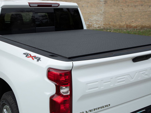 The Access B0020119 LOMAX Professional Series Hard Folding Tonneau Cover is designed for truck owners seeking durability and convenience. Featuring a robust extruded aluminum frame with diamond-plate top panels, this hard-folding cover offers a corrosion-resistant black powder coat finish. It provides an ultra-low profile, sitting less than ½ inch above the bed, with a 500 lbs. evenly distributed load capacity. This cover ensures a weather-tight seal to keep your cargo dry and secure. Easy installation with TIGHT BITE clamps and a tool-free removal process makes it simple to use and maintain.