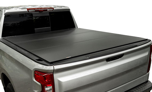 The Access B5050079 LOMAX Hard Folding Tonneau Cover offers a sleek, low-profile design with superior protection for your truck bed. Made from durable aluminum and available in carbon fiber, it supports up to 400 lbs of weight. The cover features under-panel channels for added security and a water-tight seal, while flexible rubber seals reduce vibrations for a smooth ride. Installation is easy, requiring no drilling, and can be done by a single person using the Tight Bite clamps. This cover is backed by a 3-year limited warranty, ensuring long-lasting performance.