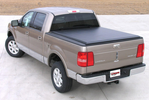 The Access 34189 LiteRider Roll-Up Tonneau Cover protects your truck bed with a durable, double-coated vinyl material that resists fading and remains flexible in extreme temperatures. Its AutoLatch system locks automatically, while the side lock provides extra security. The cover installs easily with six Tight Bite aluminum clamps and rolls up for full bed access. The exclusive Slantback design enhances aerodynamics and style. Featuring a Quick Clip storage system, this roll-up tonneau cover ensures secure cargo storage and long-lasting performance.
