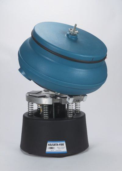 The Raytech 23031R Tumble Dump, 40 is a compact vibratory tumbler built for heavy deburring, flash removal, and polishing metal or plastic parts. Featuring a patented tilting plate for fast unloading, amplitude adjustment, and compound rinsing ports, it handles tough jobs with ease. This model includes a noise-reducing lid and a 17-inch polyethylene bowl with a .35 cubic ft capacity, making it ideal for efficient finishing tasks on a wide range of materials.