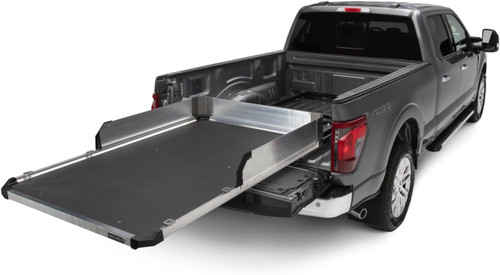 A truck bed equipped with a slide-out tray, enhancing storage and accessibility for various items.