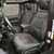 Jeep interior with sleek black leather seats features a Smittybilt Neoprene Seat Cover Set for both the front and rear.