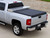 The Access 62289 Toolbox Soft Roll-Up Tonneau Cover is designed for 2007-2014 Chevrolet Silverado and GMC Sierra 2500/3500, plus 2007-2013 1500 models with a 6'6" bed. It fits behind most 20-21" toolboxes, providing extra storage without blocking toolbox access. Featuring an all-aluminum frame and durable vinyl fabric, it withstands harsh weather. The XT-Dial tension adjusters allow easy tarp tightening, while the hook-and-loop sealing system ensures a secure fit. This roll-up tonneau cover is easy to install and works with most bed liners, tailgate protectors, and tie-downs.