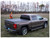 The Access 15169 Original Roll-Up Tonneau Cover by Agri-Cover provides durable protection for your truck bed against water, snow, and dust. Its twist-dial release system allows easy rolling, while dual side latches secure the cover automatically. A built-in tension adjuster ensures a snug fit. Made from high-quality vinyl, this roll-up tonneau cover is easy to install and backed by a limited lifetime warranty. Designed for convenience and durability, it enhances truck bed security while maintaining accessibility.