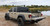 The Access 13259 Original Roll-Up Tonneau Cover offers durable cargo protection with a commercial-grade vinyl tarp and a lightweight aluminum frame. The AutoLatch II dual locking system secures both sides instantly, while the XT-Dial tension adjuster ensures a tight fit. Sealed on all sides with the ELEMENT SEAL gasket, it protects against moisture and debris. The hook-and-loop system allows easy operation, and Tight Bite clamps enable no-drill installation. Premium storage straps secure the rolled cover, preventing contact with the cab. Fits 72-inch truck beds.