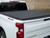 The Access B0020099 LOMAX Professional Series Hard Folding Tonneau Cover provides durable truck bed protection with an ultra-low-profile design that enhances aerodynamics. Built with a diamond-plate aluminum top and a corrosion-resistant black powder coat finish, it supports up to 500 lbs. evenly distributed. Its weather-tight seal keeps cargo dry, while heavy-duty nylon latches ensure a secure fit. The no-drill TIGHT BITE clamp system allows easy installation and tool-free removal for oversized loads. Made in the USA, it offers strength, security, and convenience.