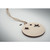 Wooden bauble-shaped hanger with spruce seeds