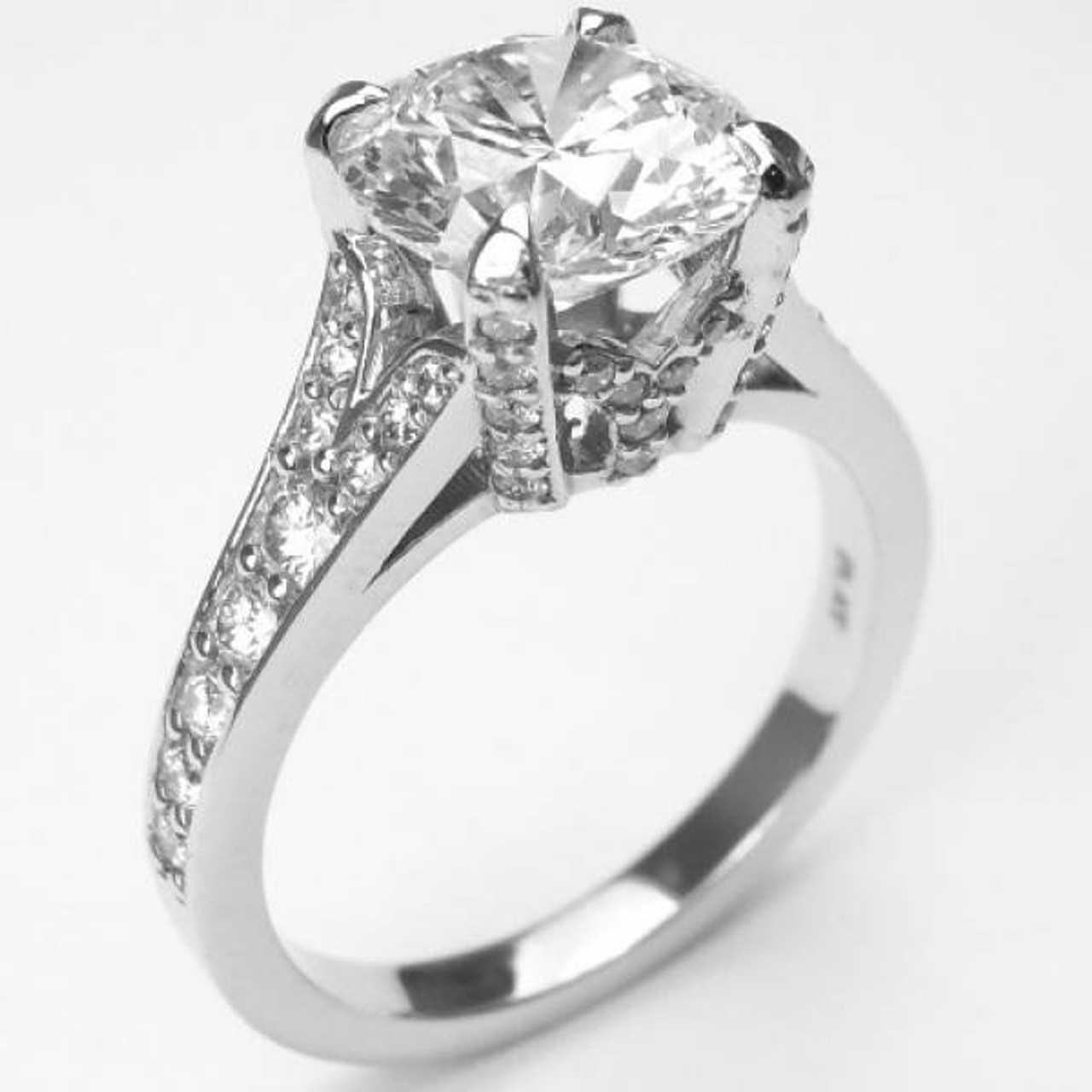 Eagle claw, crown setting solitaire. Diamonds in platinum
