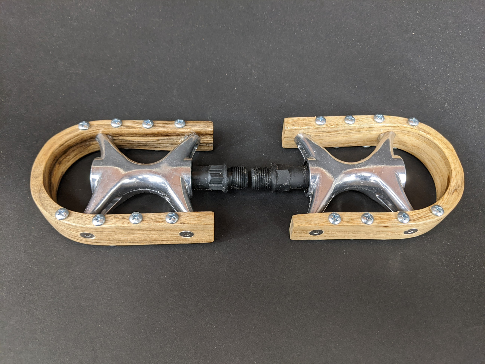 Renovo solid wood bent pedals for road or mountain bike riding. Bring some of the woods to your town. Specify road or mountain traction and platform or platform/clipless in your order notes.