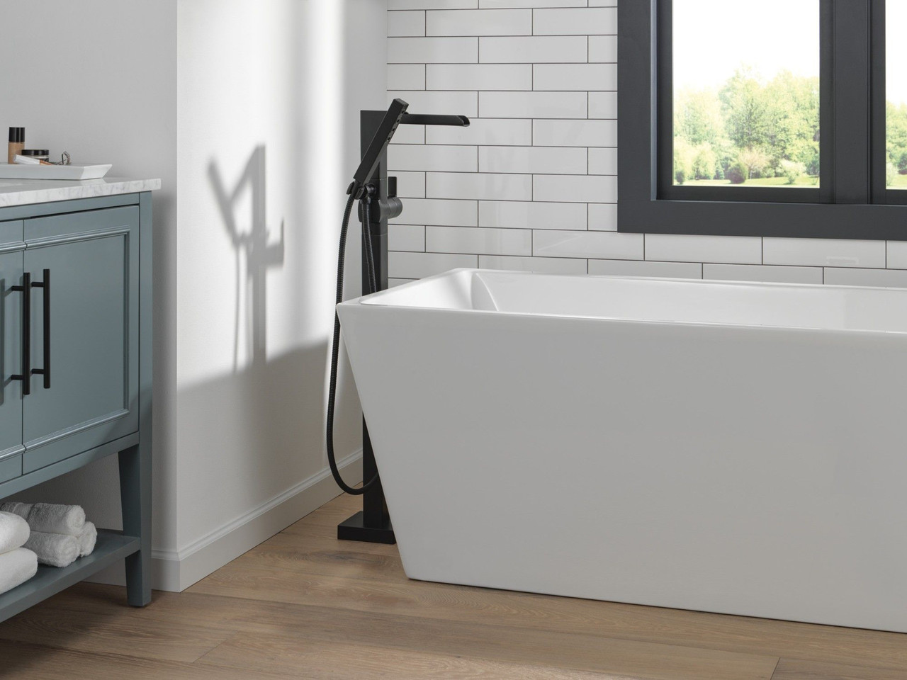 Delta T4768-BLFL Ara Delta Ara Single Handle Floor Mount Channel Spout Tub Filler Trim with Hand Shower, Matte Black