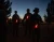 Soldiers wearing chemical lights at sunset. 
