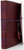 Cherry Red genuine leather journal.  Handstitched with Purple coloured Italian thread. Made in Australia. Kangaroo leather wrapping strap.