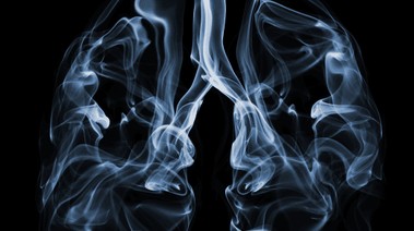 Lungs in blue smoke highlight smoking's consequences; explore our science-backed quitting resources.