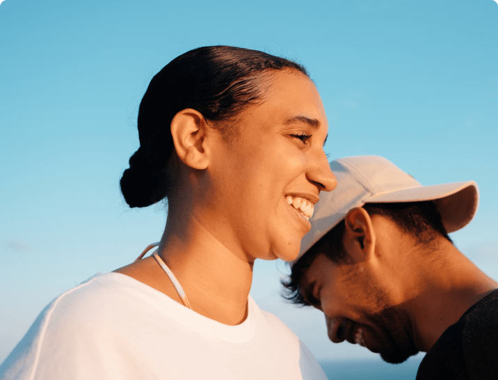 a girl and a guy laughing by each other