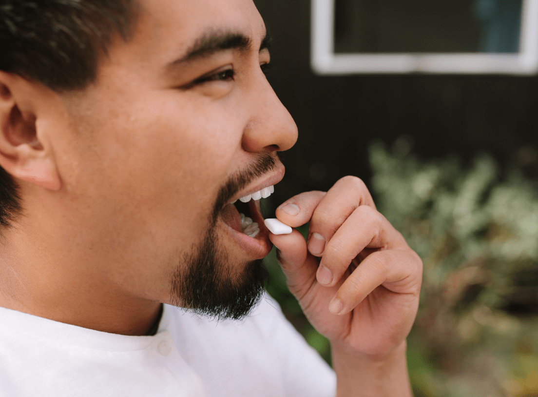 Guy about to chew gum and not smoke