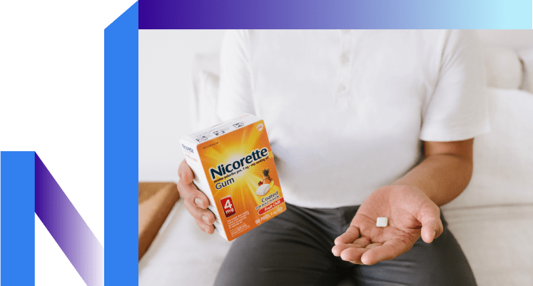 Man looks at gum contemplating chewing.