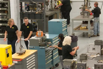 Workers performing incoming inspection of raw materials