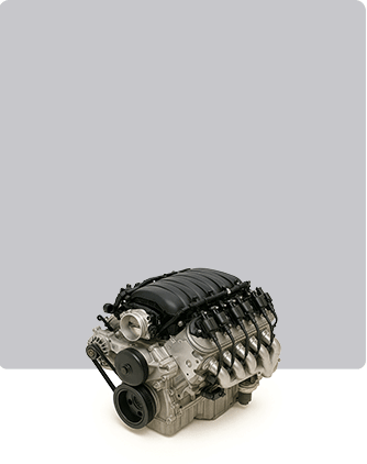 An image of a car engine set on a white background, emphasizing its mechanical features