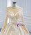 Champagne Tulle Appliques Beading Long Sleeve Wedding Dress