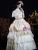 Close-up of the delicate lace trim and champagne satin fabric on this vintage gown