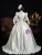 Side view showing the corset bodice and elegant silhouette of the champagne vintage dress