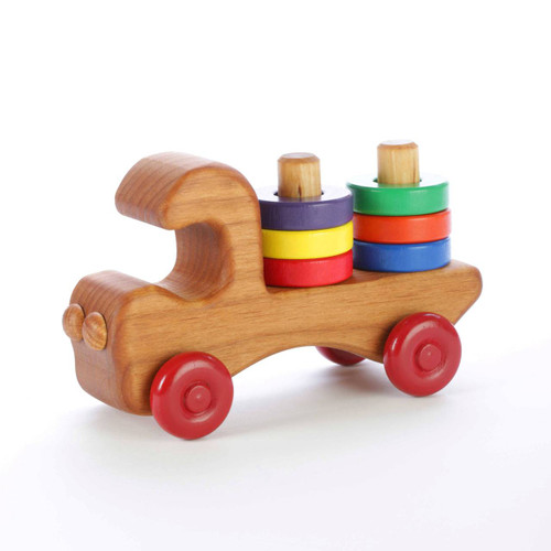 Our wooden stacker truck features six brightly colored removable wooden rings for teaching colors and hand-eye coordination. Made of locally-harvested Oregon alder and finished with non-toxic paints and food-grade mineral oil. Handcrafted in Oregon, USA. Our wooden stacker truck features six brightly colored removable wooden rings for teaching colors and hand-eye coordination. Made of locally-harvested Oregon alder and finished with non-toxic paints and food-grade mineral oil. Handcrafted in Oregon, USA.