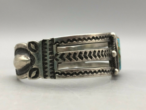 Hand stamped Fred Harvey  era cuff, with a turquoise stone that has a lovely tan/brown matrix.