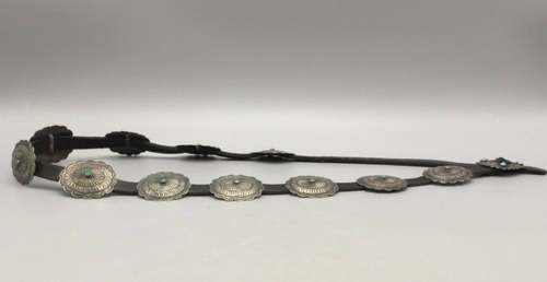 Concho belt with oval conchos with small turquoise stones.