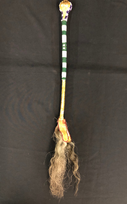 beaded "skull cracker", rawhide, horsehair tassel, stone wrapped