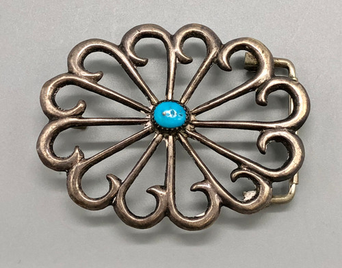 sandcast and turquoise belt buckle, flower or wave like design, turquoise cabochon