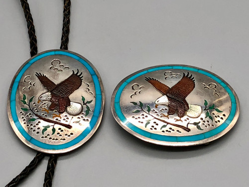 eagle themed bolo and belt buckle set, highly detailed features such as carved feathers, claws, leaves and wooden branch, hand stamped designs