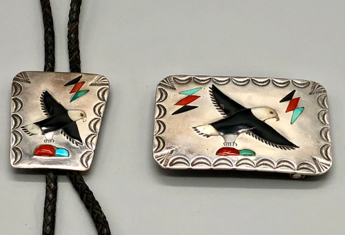 Zuni eagle themed inlay bolo and belt buckle set, inlay of onyx and mother of pearl, coral, turquoise, hand stamped designs, braided black leather cord