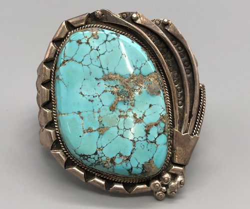 vintage turquoise and sterling silver bracelet, grand turquoise cabochon in a handmade sawtooth bezel, four wire terminal